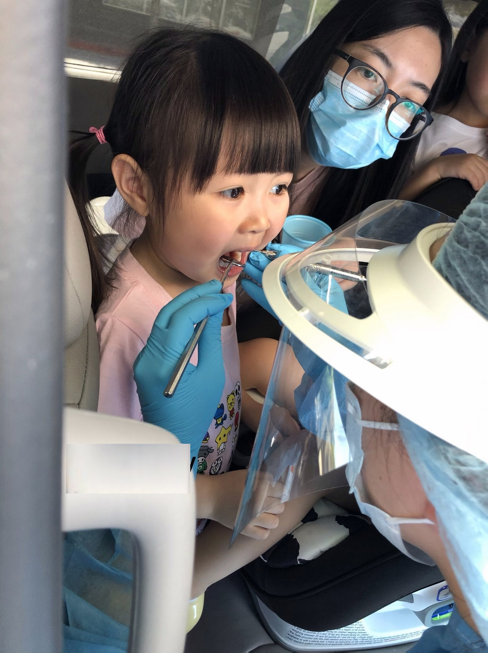 A child receives fluoride varnish application