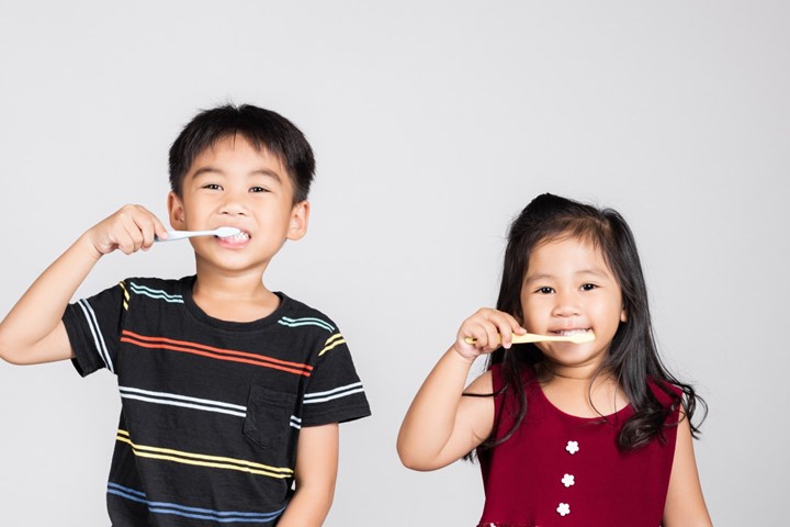 photo of kids brushing their teeth